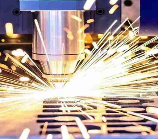 Laser cutting machine slicing through metal with precision and sparks flying