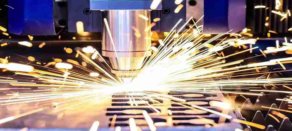 Laser cutting machine slicing through metal with precision and sparks flying